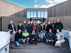 A group of people in front of the ESO.
