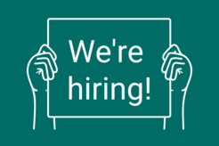 illustration: hands hold sign saying "We're hiring!"